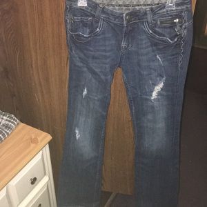 Dark blue distressed jeans